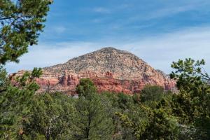 a mountain with trees in front of it at Sedona Hilltop Retreat Deck with Red Rock Views in Sedona +9 photos