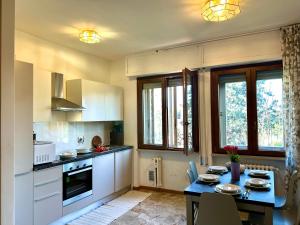 a kitchen with a table and a dining room at Nel cuore etrusco dell'Umbria in Perugia +29 photos