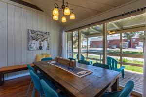 a dining room with a wooden table and chairs at BEAUTIFUL Rustic Modern Remodel IDEAL Location!! in Pagosa Springs