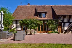 Vonkajšia záhrada v ubytovaní Gîte de la ferme Cour Lecoq