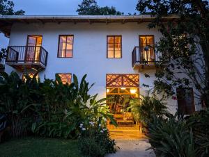 a white house with two balconies on it at Terrazas de Salento in Salento