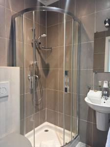 a bathroom with a shower and a toilet and a sink at Nice Garden Hotel in Nice +73 photos