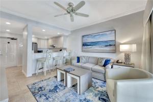 a living room with a couch and a table at Bellasera Resort in Naples