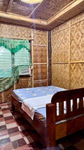 Tempat tidur dalam kamar di Felban's Farm