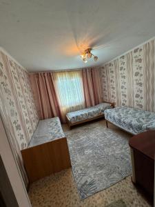 Postel nebo postele na pokoji v ubytování Ak-keme