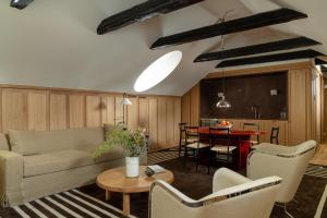 a living room with a couch and a table at Stockholm Stadshotell in Stockholm