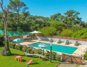 an image of a swimming pool in a backyard at IQU Apart in Las Gaviotas +13 photos