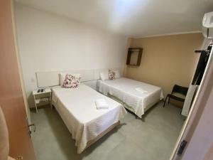 Voodi või voodid majutusasutuse Hotel Sur Brasil toas