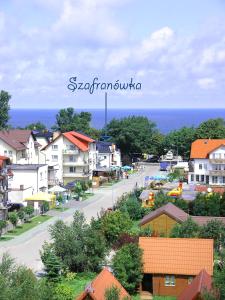 a view of a town with houses and a street at Szafranówka in Władysławowo