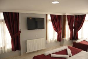 TV a/nebo společenská místnost v ubytování Sunrise Istanbul Suites
