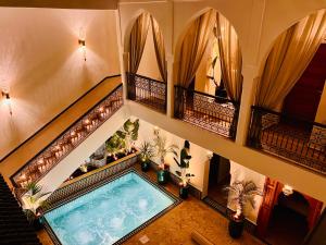 an overhead view of a swimming pool in a building at Villa Dar Al Hayat in Marrakesh