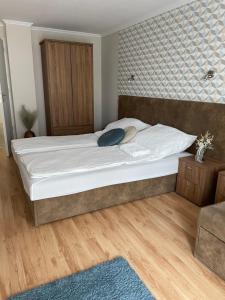 Postel nebo postele na pokoji v ubytování Thermal Garden Weninger Apartmanok