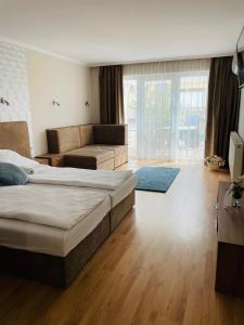 Postel nebo postele na pokoji v ubytování Thermal Garden Weninger Apartmanok