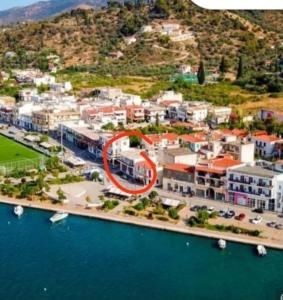 an aerial view of a resort with a red circle at magda's house in Galatas +10 photos