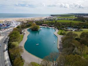 an aerial view of a lake with boats in it at Coastal Comfort Haven 3BR Retreat in South Shields