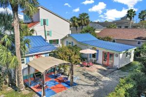 an aerial view of a house with a blue roof at Suncatcher Cottage 1508-2nd Avenue B in Tybee Island
