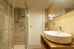 a bathroom with a sink and a shower at Casa dei Papi - Guest House in Rome +8 photos