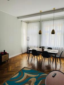 a living room with a table and chairs at Apartamenty Baltic Sea Graniczna in Kołobrzeg