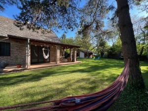 a hammock in the yard of a house at Tágas hely a parton in Balatonszárszó
