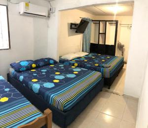 Postel nebo postele na pokoji v ubytování Casa Santorini II