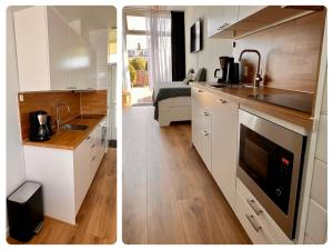 a kitchen with a sink and a stove top oven at Reumann Holiday Apartments De Schelp 12 in Zandvoort
