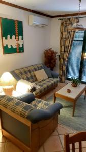 Uma área de estar em Villas Terrace Apartment
