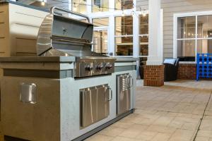 an outdoor grill with a stove in a patio at Residence Inn by Marriott Fredericksburg in Fredericksburg