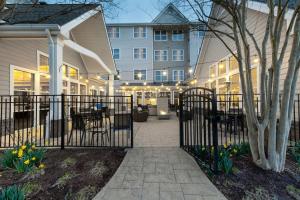 a wrought iron fence in front of a building at Residence Inn by Marriott Fredericksburg in Fredericksburg