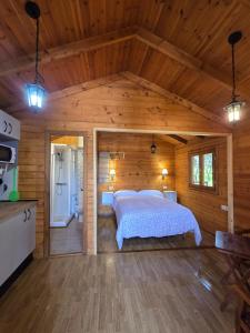 Postel nebo postele na pokoji v ubytování Nuevo Ecolodge Cabañeros