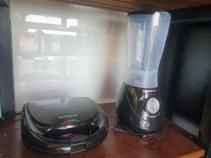 a blender sitting on top of a table at Chalé Bem-Te-Vi Cachoeira & SPA in Brotas