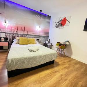 En eller flere senge i et værelse på Habitación loft centro + 2 billeder