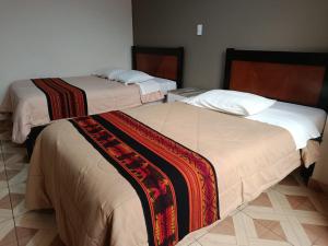 เตียงในห้องที่ Hotel Montaña White villasol