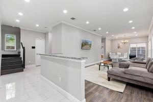 a kitchen and living room with a couch and a table at Game Room & Event Open Luxury Haven in Dallas +22 photos