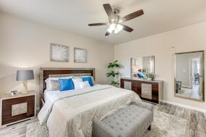 a bedroom with a bed and a ceiling fan at 3 Mi to Hospitals Stylish Condo in San Antonio! in San Antonio +16 photos
