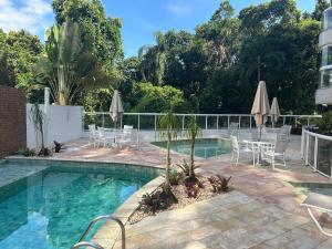 Swimmingpoolen hos eller tæt på Brisa do mar Riviera de São Lourenço