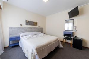 Postel nebo postele na pokoji v ubytování Hotel España