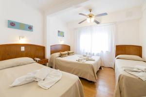 Postel nebo postele na pokoji v ubytování Hotel España