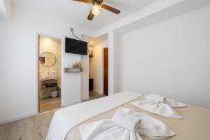Postel nebo postele na pokoji v ubytování Hotel España
