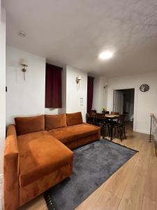 a living room with a couch and a table at Villa Arancia Istanbul - Garden, BBQ, Sauna & Turkish Bath by the Tram in Fatih in Istanbul