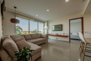 a living room with a couch and a table at Edificio Morros Vitri, 2 Bedrooms- Comfy Apartment in Cartagena de Indias