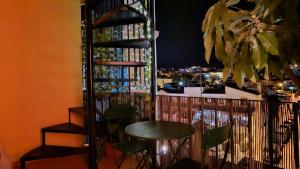 a table and chairs in front of a bar at Apartamento Marion in Cala del Moral
