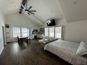 a bedroom with a bed and a ceiling fan at The Loft in Kennesaw