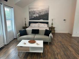 a living room with a couch and a bed at The Loft in Kennesaw