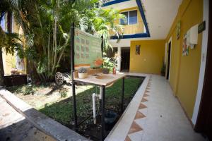 a table in front of a building with a sign at Nicte Ha Campeche in Campeche +42 photos