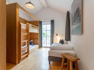 A bed or beds in a room at Haus Aifnerspitze