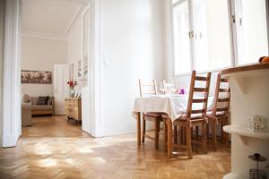 a dining room with a table and chairs at City Apartment Budapest in Budapest