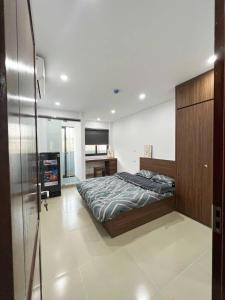 a large bedroom with a bed and a desk at Heart Homestay in Hanoi