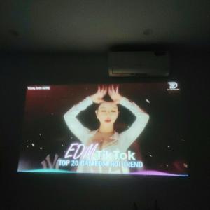 a television screen with a picture of a woman on it at Heart Homestay in Hanoi