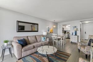 a living room with a couch and a table at KIHEI BEACH, #109 condo in Kihei