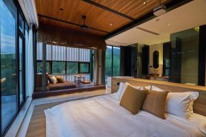 Postel nebo postele na pokoji v ubytování Anji Yuzizai Resort + 247 fotografií